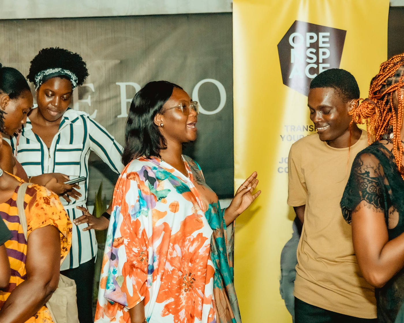 Members mingling by the OPENSPACE banner